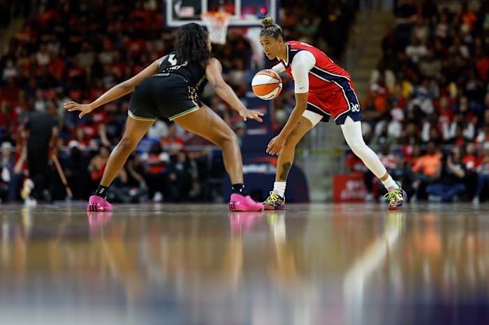 New York Liberty forward Betnijah Laney defends Washington Mystics guard Natasha Cloud.